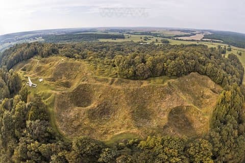 The Butte de Vauquois (View of the huge mine funnels at the top of the hill where the village and its church were located)