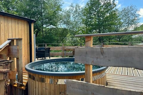 Private Nordic bath heated over wood fire