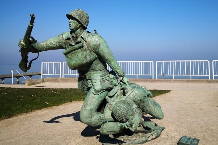 Omaha Beach. Vierville Sur Mer. "Dog Green" sector. The bronze statue represents 2 americans soldiers from the first wave (U.S 29th Infantry Division) running accross the water on D-day.
