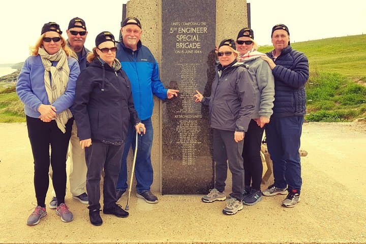 "In the steps of their father in Normandy" (Omaha Beach)
