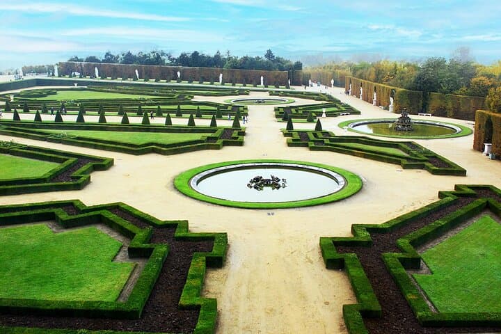 Stroll through the breathtaking gardens of Versailles, a masterpiece of landscape design filled with vibrant flowers, grand fountains, and stunning sculptures.