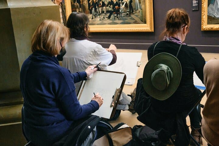 3 ladies drawing in the museum