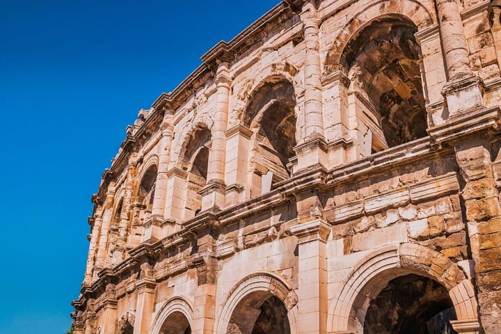 A must-see symbol of Nîmes, the Arena impresses with its majesty and excellent state of conservation — a jewel of Roman architecture under the blue sky of the South.