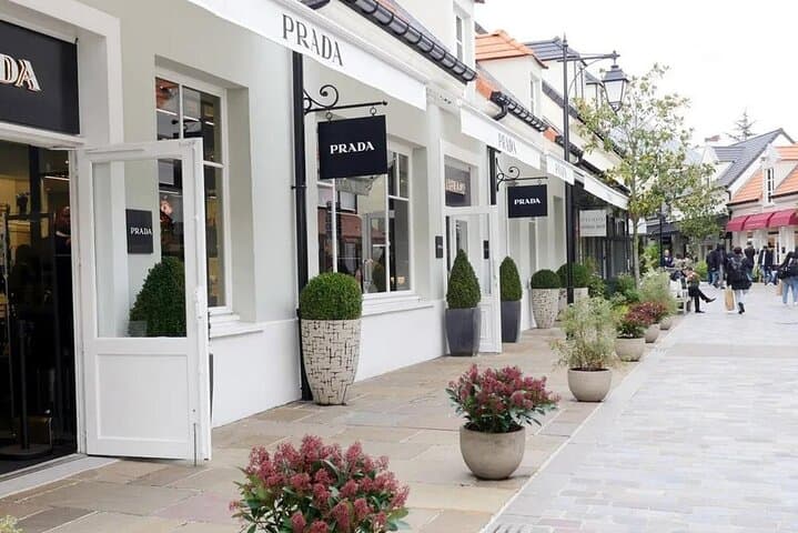 Shopping Tour to La Vallée Village Outlet in a Private Car or VAN