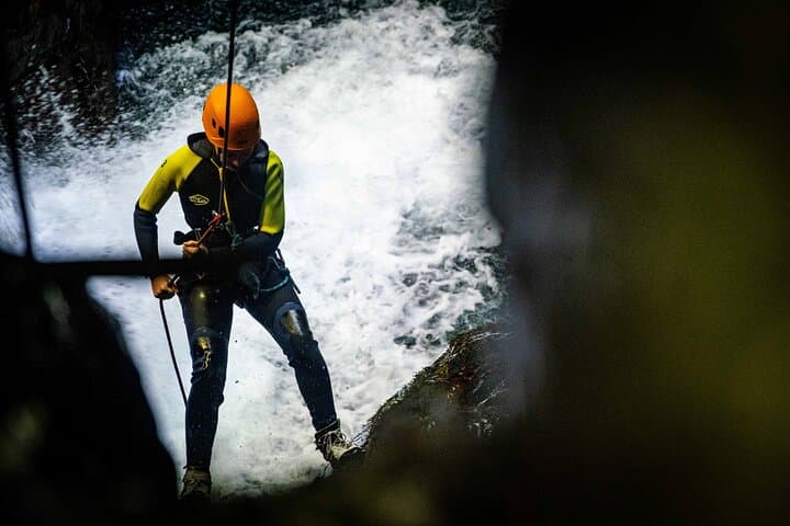 Rappelling through a cave