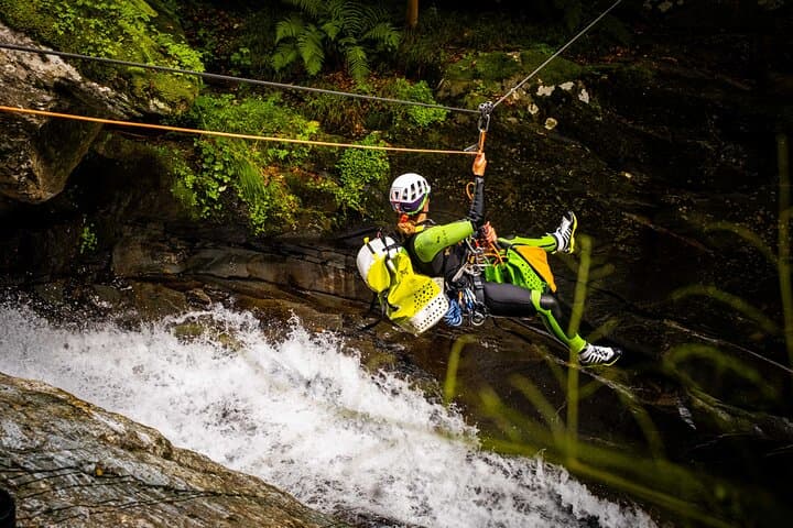 A thrilling zipline crossing above a waterfall