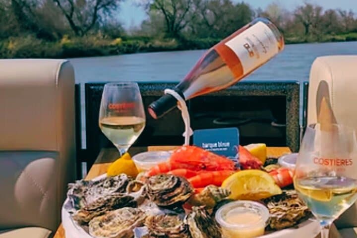 "Feast on a platter of local seafood during your boat ride on the Rhone Canal in Sete."