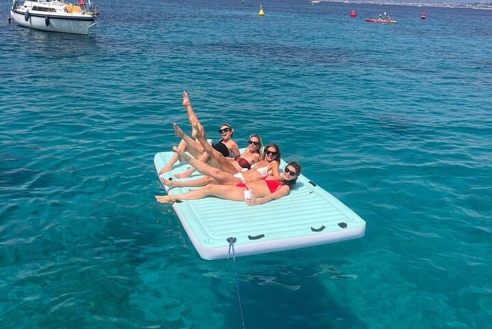 Relaxing on a floating mat during your private boat tour