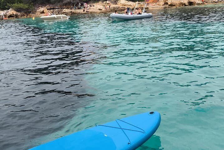 Paddleboarding stop in a protected turquoise cove