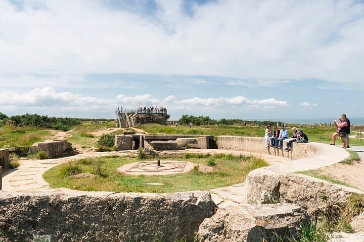 Pointe du Hoc, Normandy, France -Visitors are making photo's of the famous Pointe-Du-Hoc war site in Normandy, France. Pointe du Hoc is the highest point between Utah Beach and Omaha Beach.