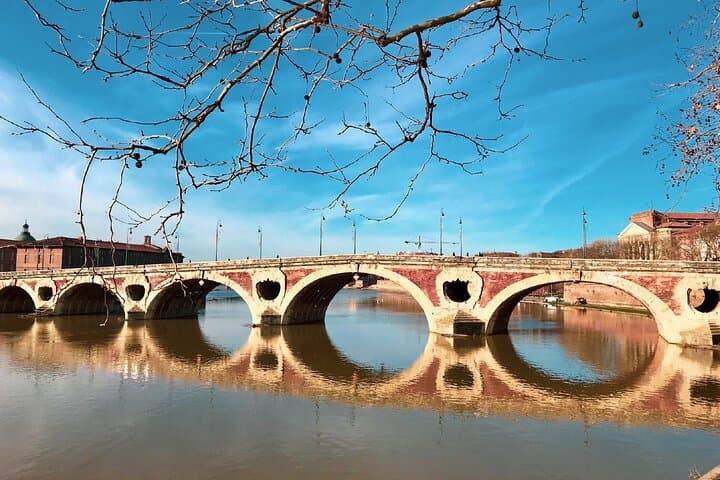 Pont Neuf: Toulouse’s oldest bridge spanning the Garonne, famous for its asymmetrical arches and sullen arches.