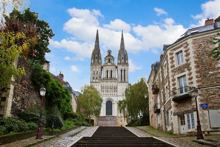 Saint-Maurice Cathedral: The ascent to the masterpiece of Angevin Gothic and its stained glass windows.