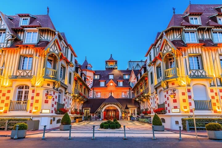 Casino Barriere: The magnificent architecture and night lights of this iconic property facing the sea.