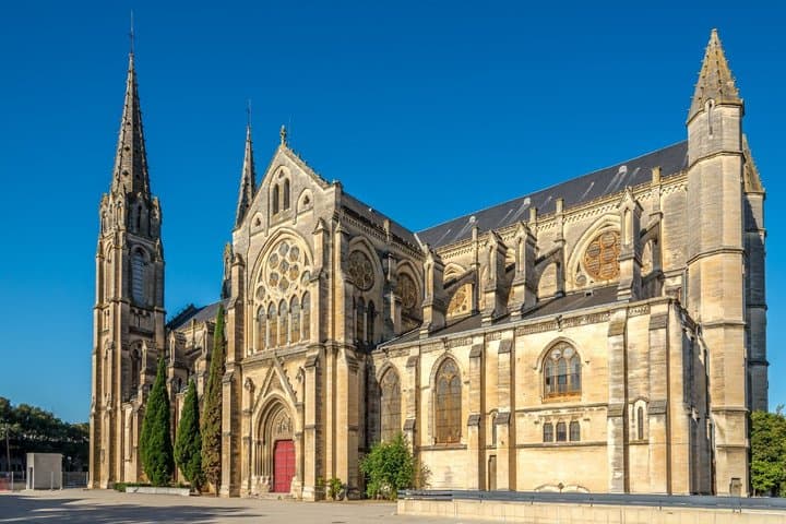 Saint-Baudile Church: The two slender arrows of this neo-Gothic building, erected opposite the ancient Gate of Augustus.