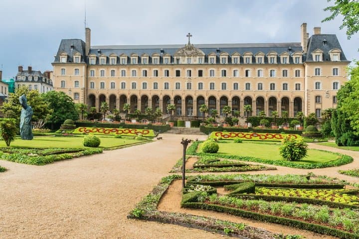 Saint George's Palace: The majestic facade of the former Benedictine abbey and its impeccable French gardens.