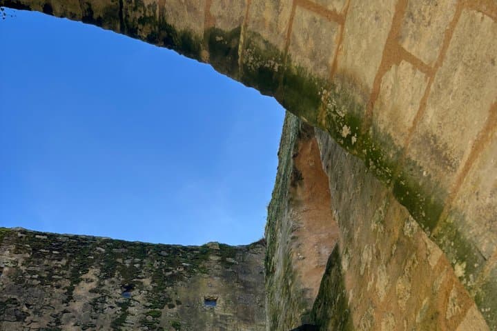 It directly adjoins the remains of the Benedictine Priory (pavilion with staircase turret).