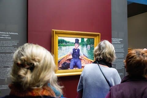 older ladies looking at a painting