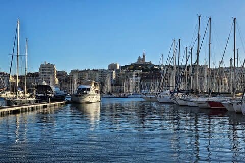 The historic Vieux Port of Marseille, with Notre Dame de la Grade basilica in the background. Absolutely stunning.