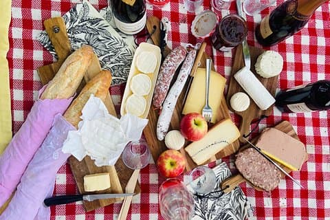 A variety of french cheese, charcuterie, seasonal fruits, and of course Baguette!