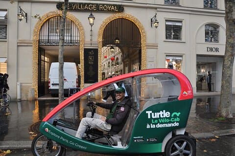 Paris visits Christmas lights on board a cab bike
