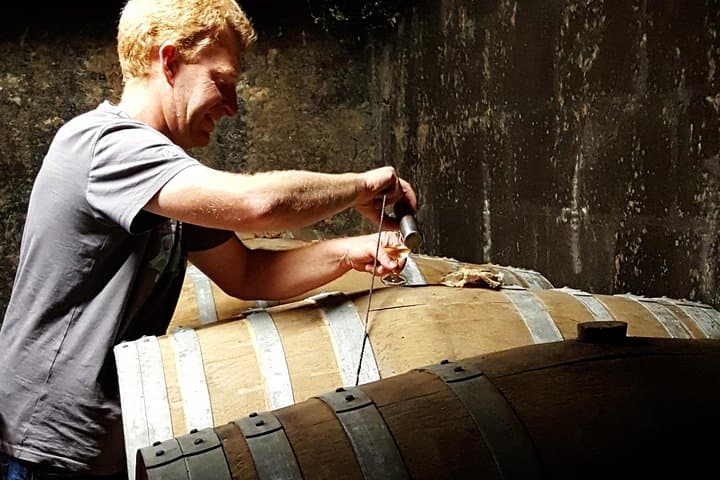 A craft distiller prepares the cognac tasting