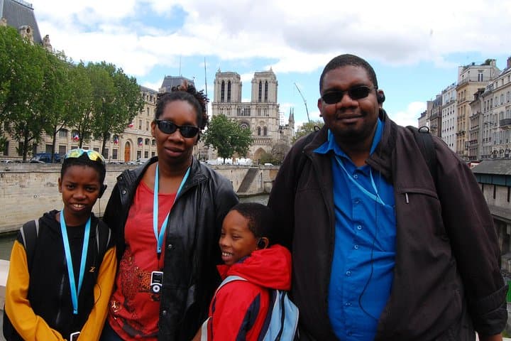 admiring the facade of Notre dame and learning about its outstanding story