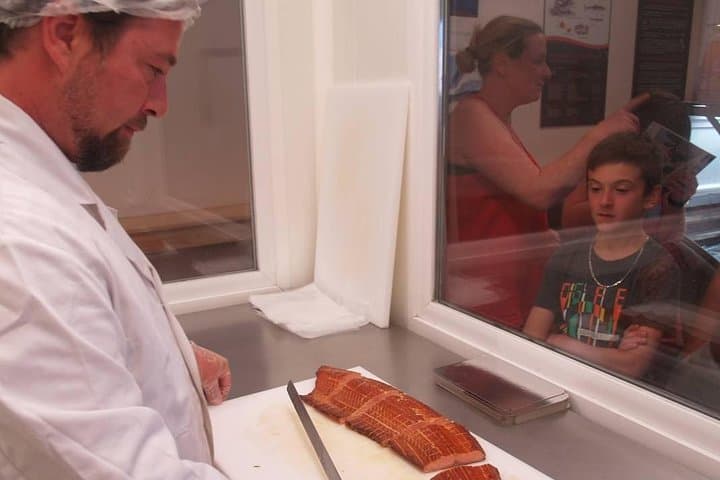 Slicing Flaky Salmon during a visit before tasting