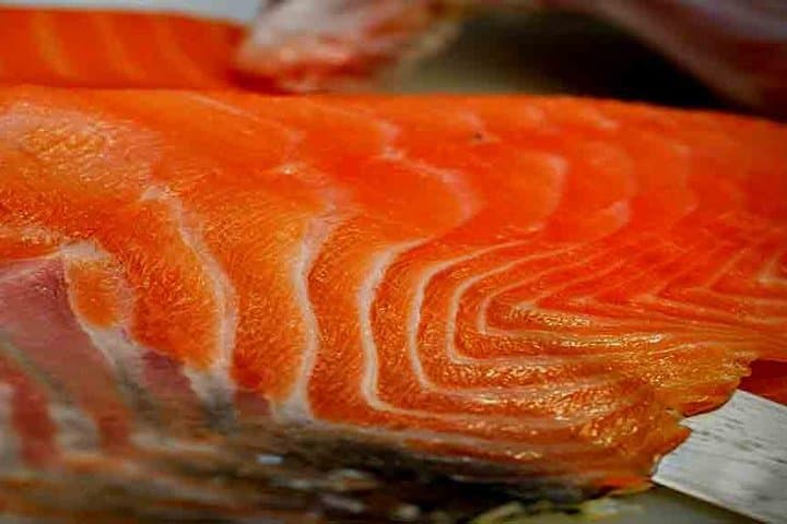 Slicing salmon fillets with a knife