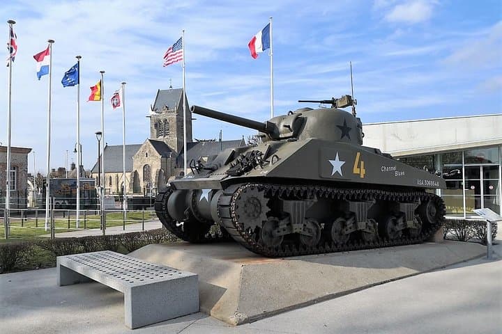 Sainte Mère l'Eglise - Airborne Museum - An U.S Sherman Tank stands proudly outside the museum (Sainte Mère Eglise Church could be seen in the background)