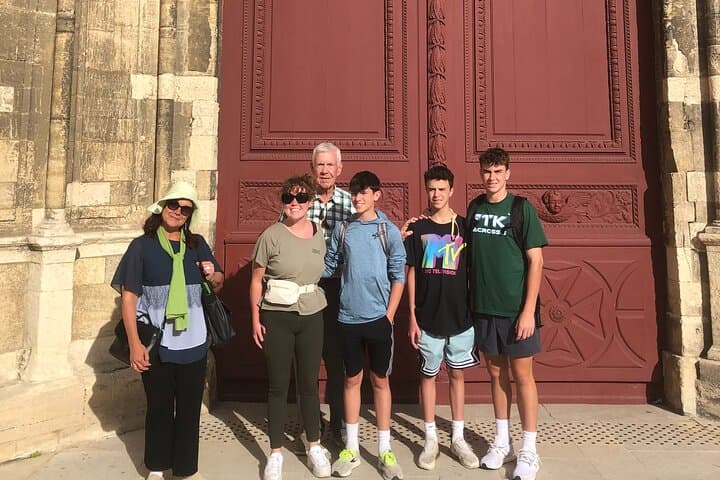 Christèle and a family in front of the cathedral