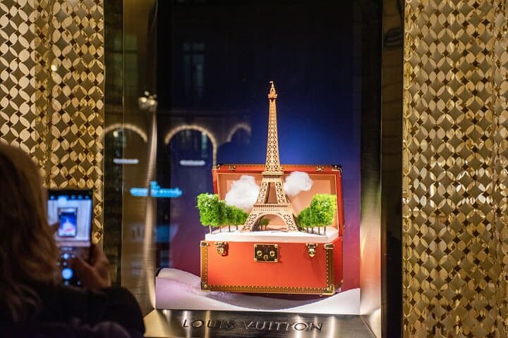 windows of Louis Vuitton case open with Eiffel Tower coming out of it