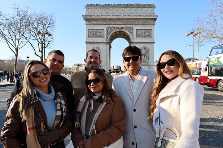 We'll stop at the iconic Arc de Triomphe to admire its grandeur and stroll along the legendary Champs-Élysées.
