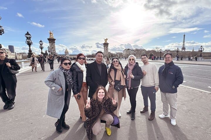A kingly gathering of clients on the Alexandre III Bridge, with a private driver at our side.