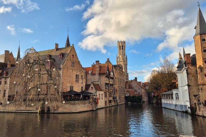 Bruges Private Tour from Paris with Champagne and Canal Cruise