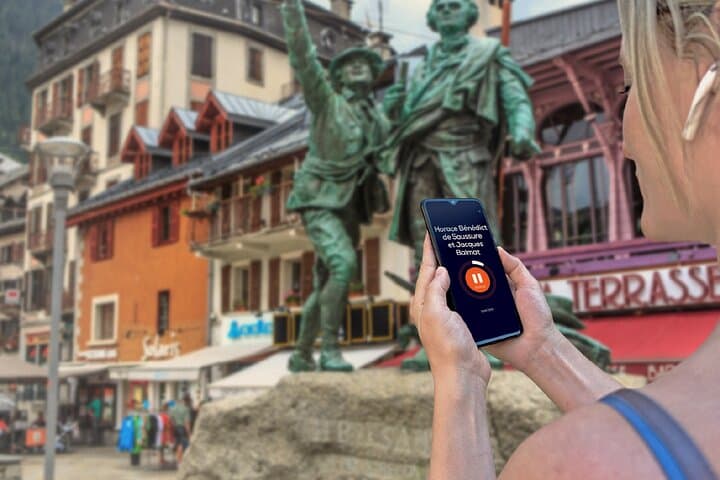 Visit of Chamonix in freedom: In front of the famous statue of Balmat et Saussure pointing towards Mont Blanc.