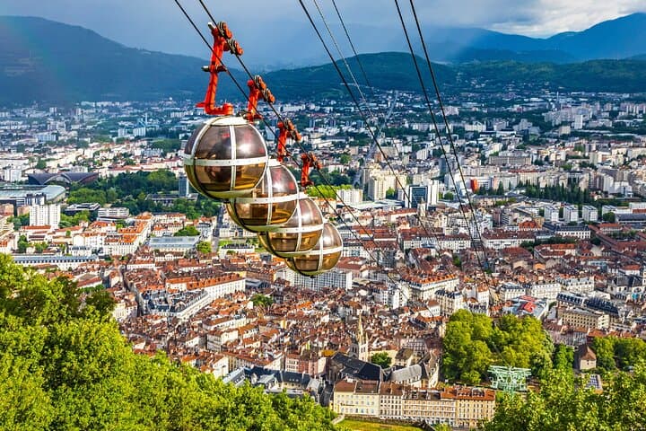 Bastille Cable Car: The famous "Bubbles" flying over the Isère and the city.