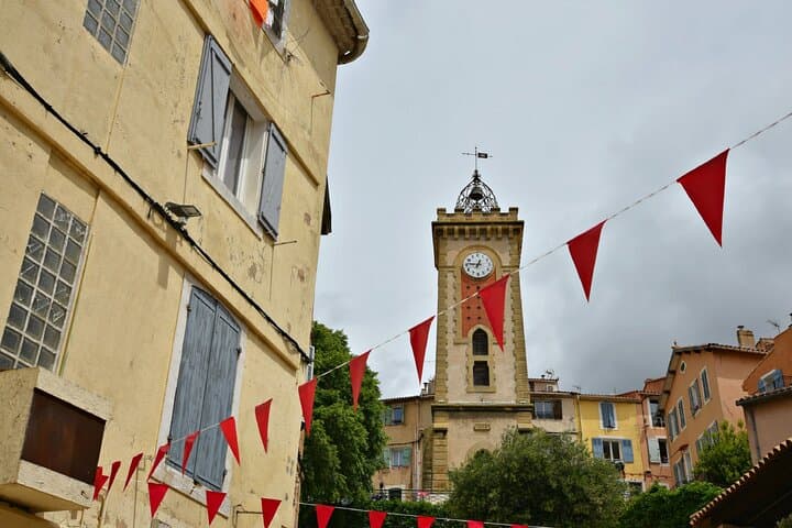 The Clock Tower: The wrought iron campanile watching over the narrow streets, typical of the villages of Provence.
