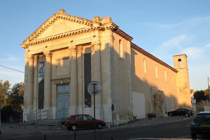 Saint-Saviour Church: The neoclassical facade of the main building, bathed in late-day light.