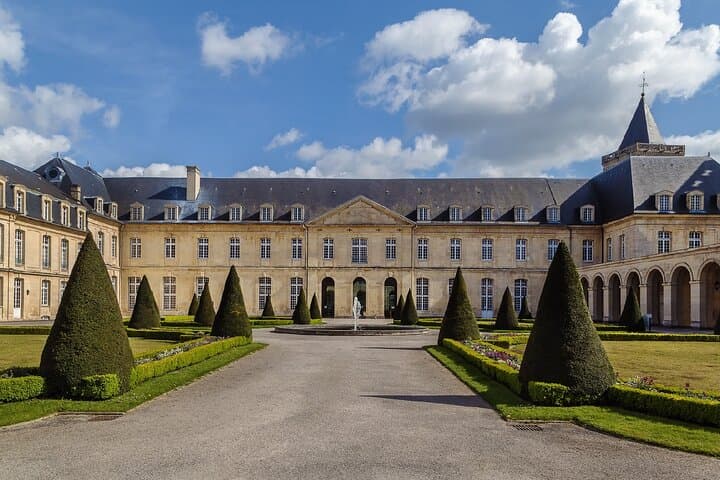 Abbey-aux-Hommes (Town Inn): The majestic classical façade of the conventual buildings, adjacent to the Abbey of Saint-Étienne.