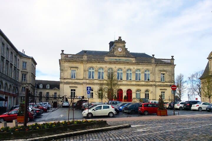 City Inn: The elegant classical architecture of the town hall and its cobblestone square, the administrative heart of the city.